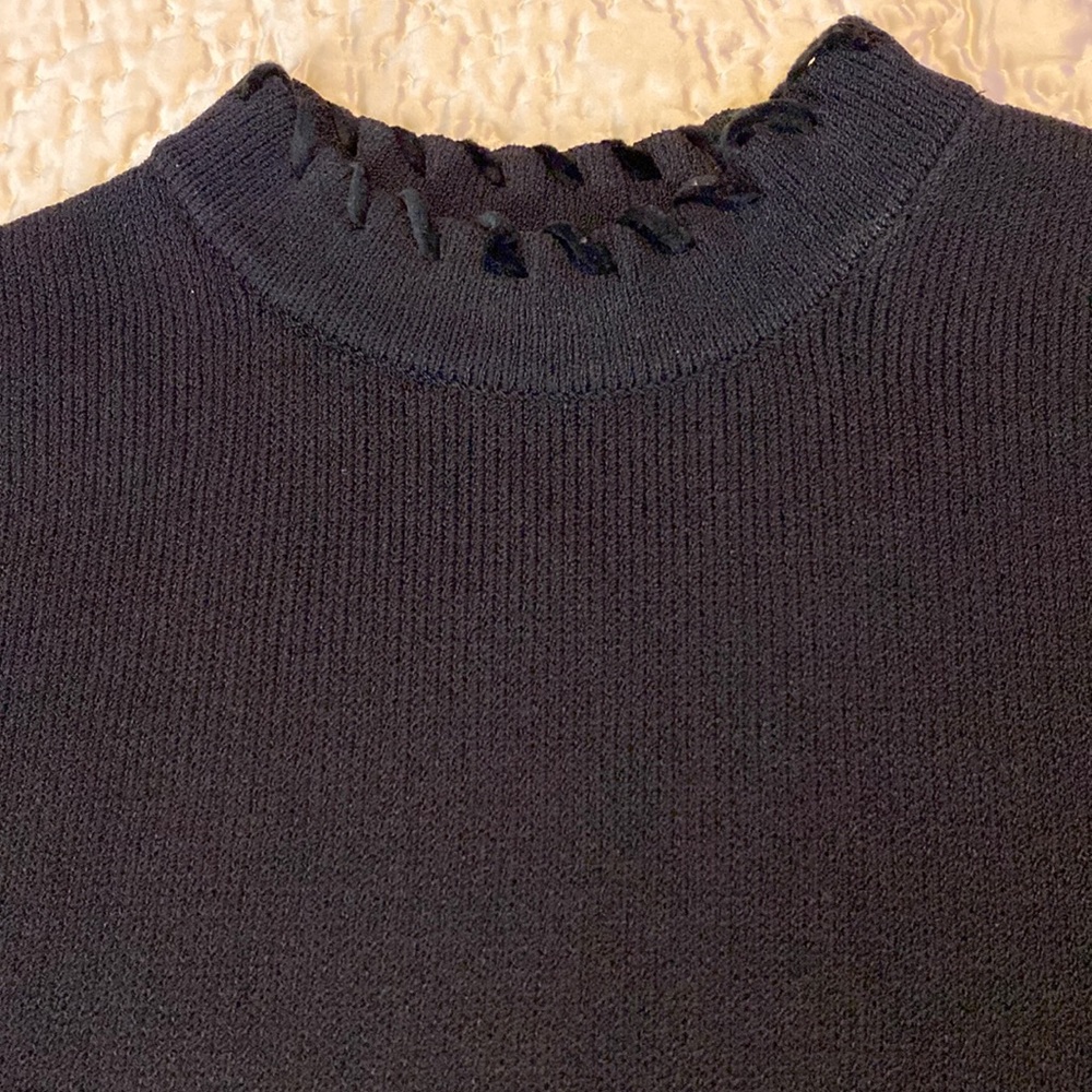 Beautiful St. John black knit shell with zipper neck and velvet ribbon trim.